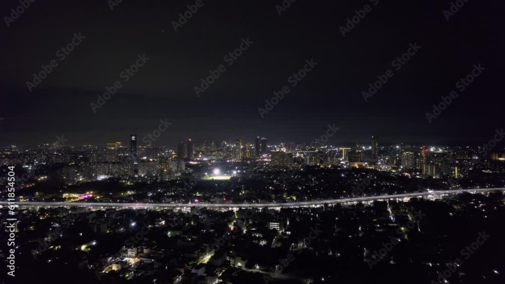 aerial drone shot flying over the cityscape of gurgaon with houses and skyscrapers with homes offices towards elevated sohna road express highway joining delhi to mumbai aerial drone shot flying over the cityscape of gurgaon with houses and skyscrapers with homes offices towards elevated sohna road express highway joining delhi to mumbai
