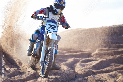 Fototapeta Naklejka Na Ścianę i Meble -  Competition, sand and motorbike for sports with action for challenge on course with power. Speed, performance and desert with bike for race or adventure in outdoor with freedom or fearless driving
