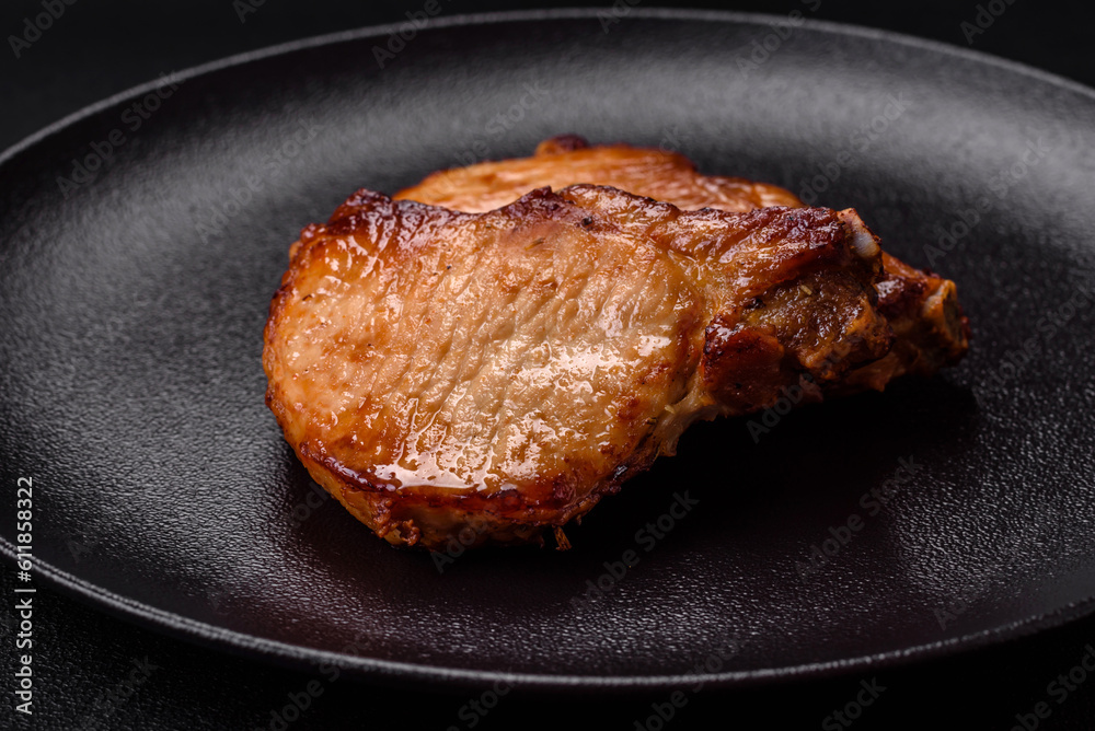 Delicious juicy pork or beef steak with salt, spices and herbs Delicious juicy pork or beef steak with salt, spices and herbs