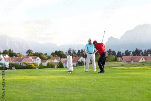 Golf course, stroke and training on the course, field or men in professional, golfer sports club and exercise on the grass. Friends, businessman or healthy game or competition on the green turf