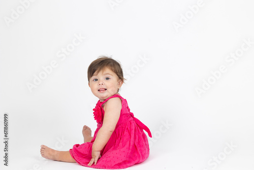baby girl in a pink dress
