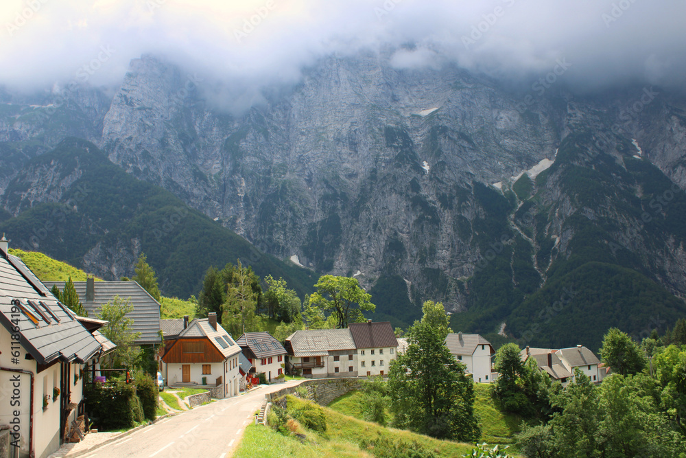 The road through the slovenian village surrounded by mountains