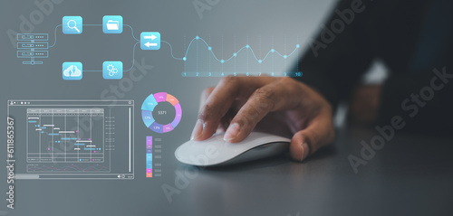 Person using computer mouse for HR and people analytics, transforming the HR landscape for sustainable business success. Deeply data-driven people processes. Data Management System