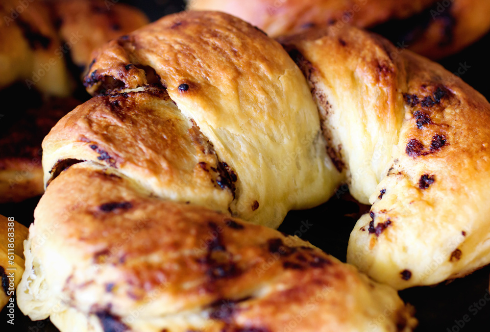 Chocolate croissant, food and bakery cooking for catering service, breakfast or baked meal at cafe. Closeup of fresh or crispy bread or dessert for eating, sweet cake or nutrition roll in the kitchen