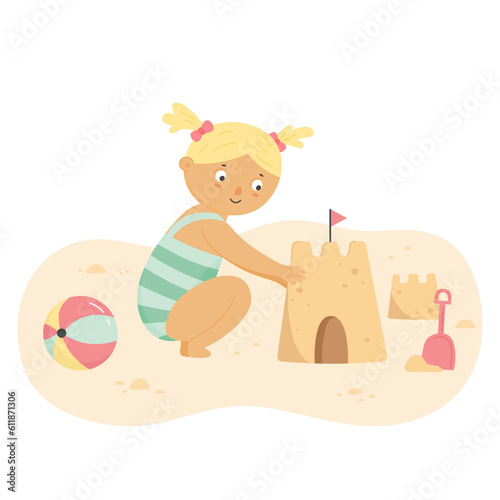 Little girl building sand castle on summer beach