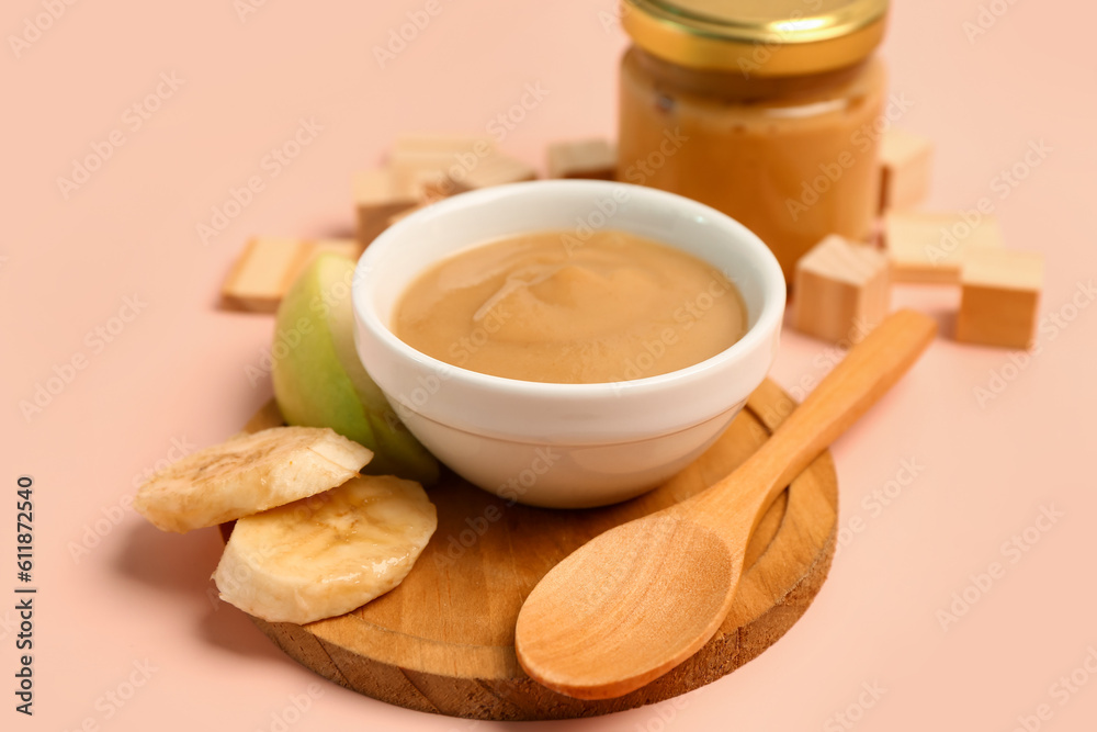 Bowl of healthy baby food on color background Bowl of healthy baby food on color background