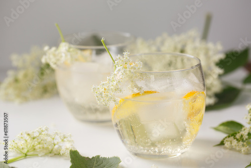 Wallpaper Mural A summer drink made of elderflowers and lemon with ice on a light background Torontodigital.ca
