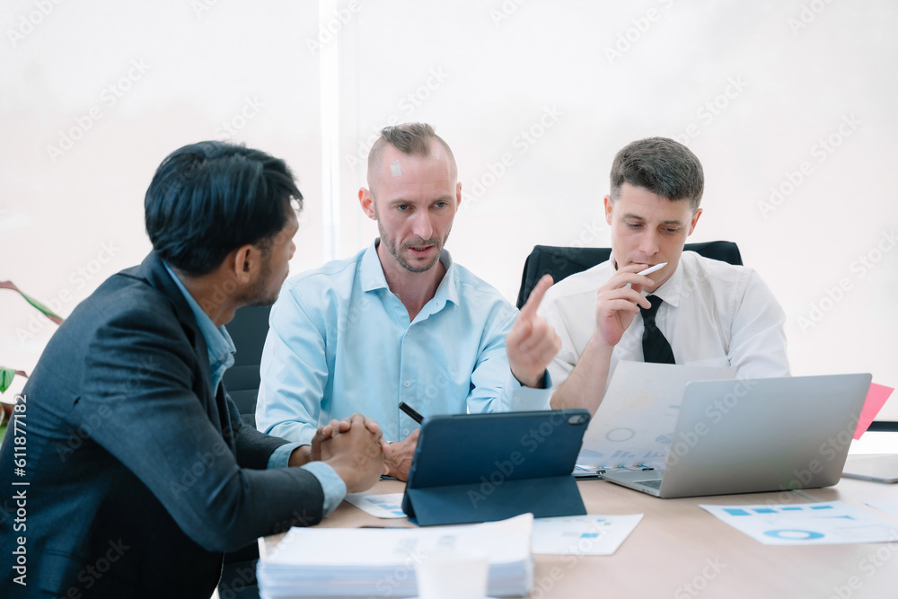 Group of diverse business people discussing a project in a meeting for analysis graph company financial. Group of diverse business people discussing a project in a meeting for analysis graph company financial.