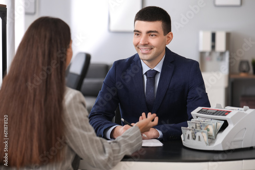 Male bank manager working w...