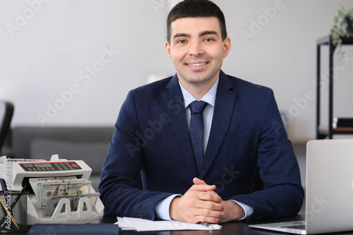 Male bank manager working w...