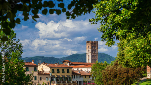 Lucca charming historical center with San Frediano (St Fredianus) medieval bell towers seen from city ancient walls public park