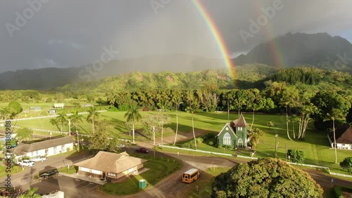 Aerial view of a pair of rainbows from over the historic Waiʻoli Huiʻia Church in the town of Hanalei, on the Hawaiian island of Kauai photo