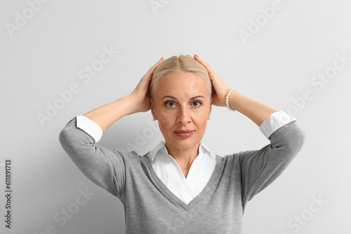 Mature blonde woman on ligh...