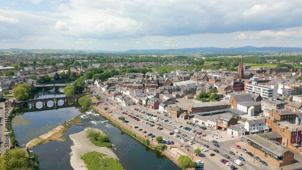 This aerial drone video shows the town of Dumfries in Dumfries and Galloway, south Scotland. The river Nith flows through the town center. This aerial drone video shows the town of Dumfries in Dumfries and Galloway, south Scotland. The river Nith flows through the town center.