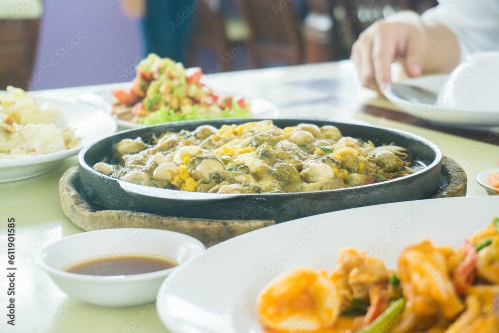 Fish with seafood spicy asian curry serve on table Fish with seafood spicy asian curry serve on table