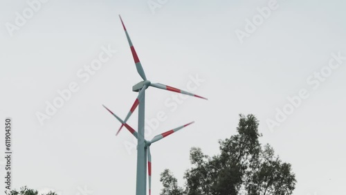Wind power plant generatore spinning in the mountains photo