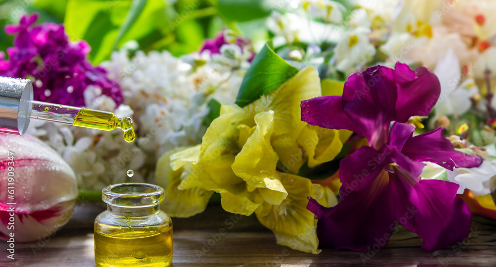 essential oil of flowers drips into a jar. selective focus. essential oil of flowers drips into a jar. selective focus.