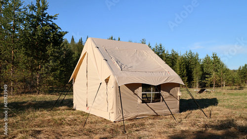Camping tent under the pine forest. Inflatable tent