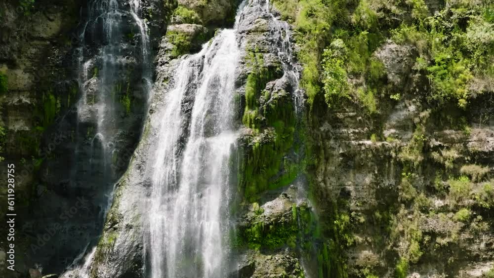 A tropical waterfall in the jungles. Slow motion. Balea Falls in the jungle. Negros, Philippines. A tropical waterfall in the jungles. Slow motion. Balea Falls in the jungle. Negros, Philippines.