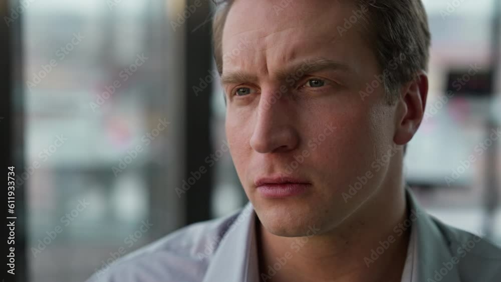 Businessman looks intently at something in front Businessman looks intently at something in front