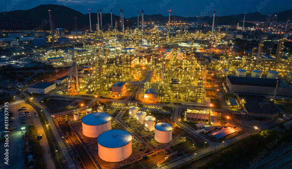 Fototapeta premium Oil refinery plant from industry zone, Aerial view tank oil and gas petrochemical industrial, Refinery factory oil storage tank