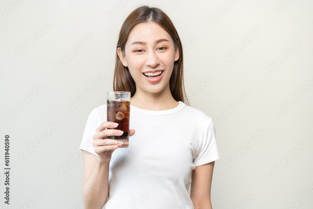 Thirsty, attractive asian young woman, girl drink or sip, holding a glass of cold sparkling water with ice in hand, refreshness people, isolated on white background. Temptation of food, health care. Thirsty, attractive asian young woman, girl drink or sip, holding a glass of cold sparkling water with ice in hand, refreshness people, isolated on white background. Temptation of food, health care.
