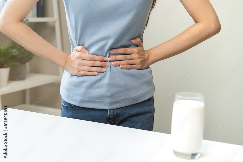 Pain, suffering asian young woman having a stomachache, abdominal pain