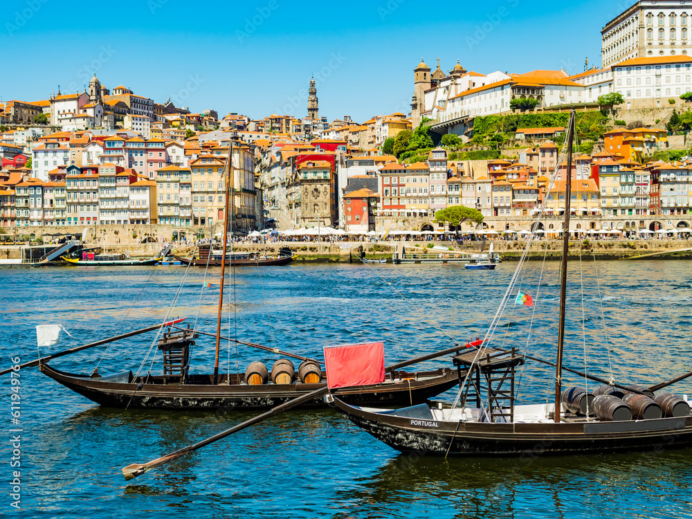 Picturesque view of Porto, with its coloured houses and traditional boats on the banks of Douro river, Portugal
