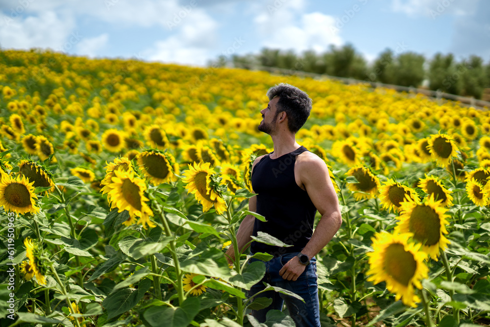 Nature's Bounty  A Farmer Embraced by Sunflowers in a Rural Landscape