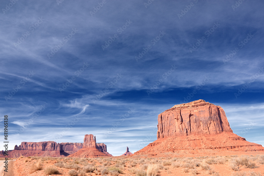 Amazing red rock formations in the Monument Valley, Navajo Tribal Park, Utah, USA. Dry dessert landscape