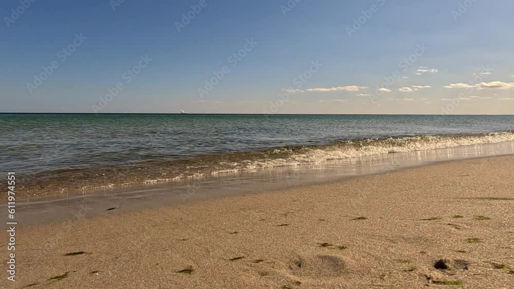 Beach in the morning. View of the calm sea and the beach on a sunny day. Beach in the morning. View of the calm sea and the beach on a sunny day.