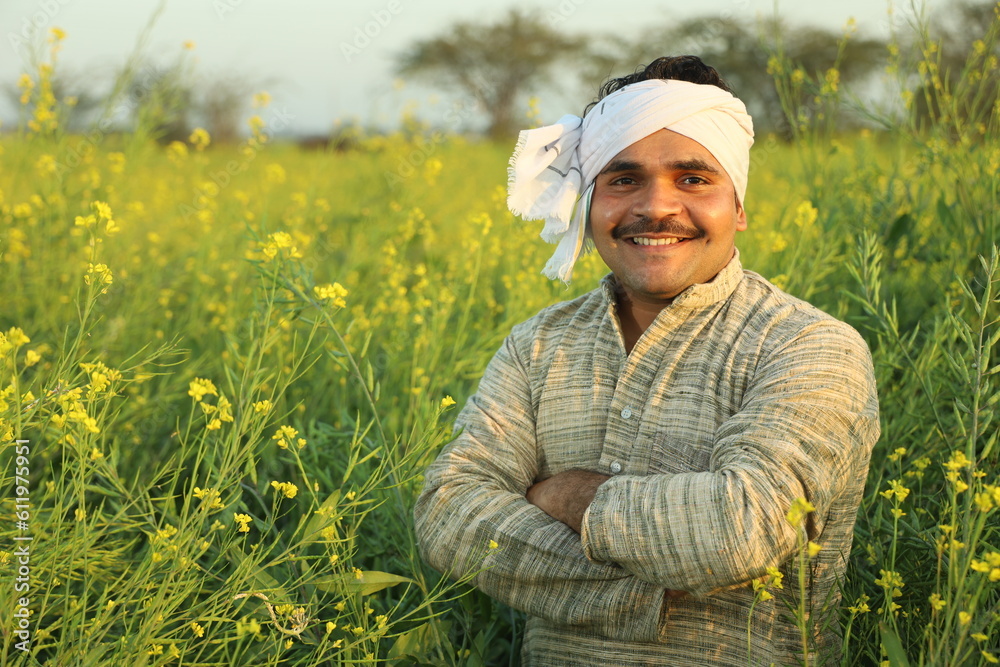 Happy Indian farmers standing in the mustard field and enjoying the ...