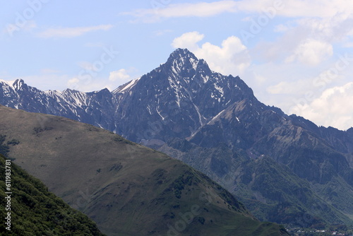 Snow-covered mountain peaks of the Main Caucasian Range. Landscape in the mountains of Georgia.