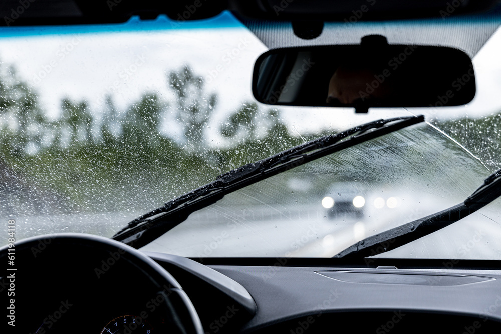 Driving in the rain on highway - obrazy, fototapety, plakaty 
