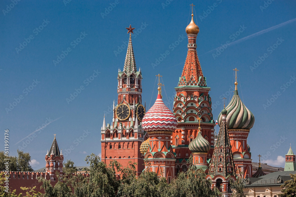 MOSCOW, RUSSIA - JUNE 9, 2023: St. Basil's Cathedral on Vasilievsky Descent on Red Square on a sunny day against a bright blue sky. A popular tourist attraction in Moscow. MOSCOW, RUSSIA - JUNE 9, 2023: St. Basil's Cathedral on Vasilievsky Descent on Red Square on a sunny day against a bright blue sky. A popular tourist attraction in Moscow.
