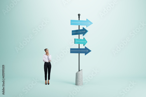 Right decision and choice concept with pensive businesswoman looking at signpost with blue arrows in different direction on abstract light background