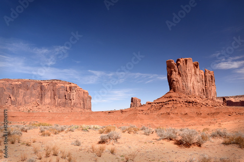 Amazing red rock formations in the Monument Valley, Navajo Tribal Park, Utah, USA. Dry dessert landscape