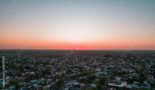 reddish sun setting on the horizon at sunset