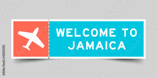 Orange and blue color ticket with plane icon and word welcome to jamaica on gray background