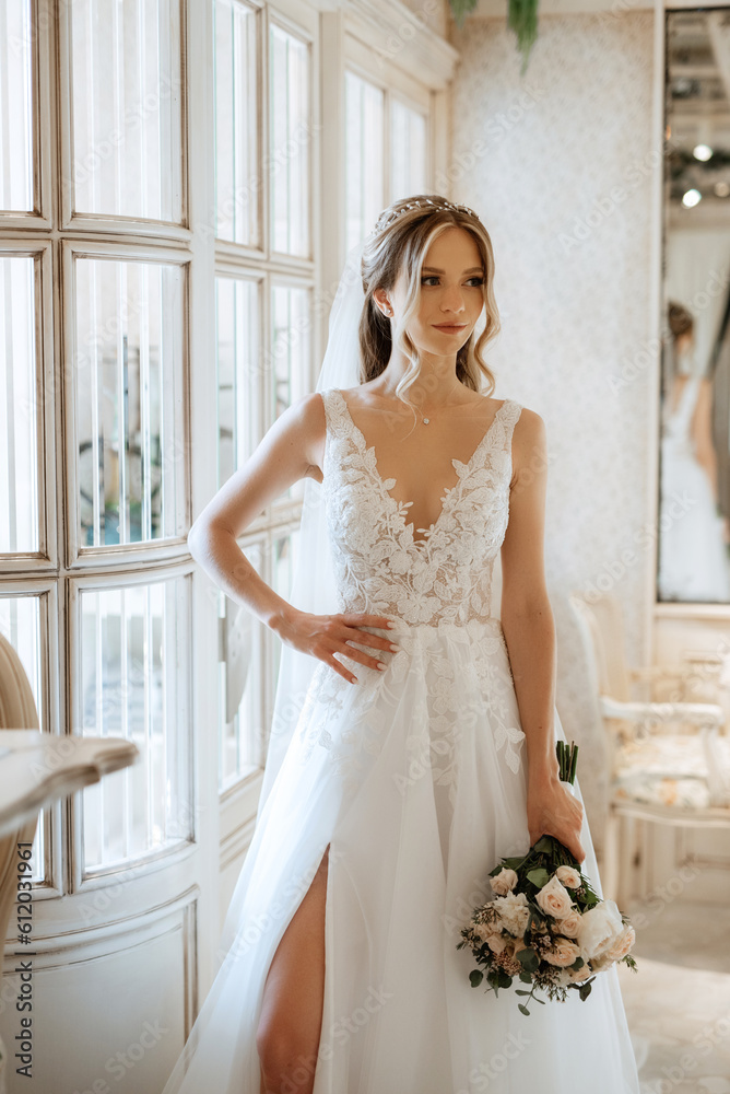 portrait of a bride in a white dress in a bright cafe portrait of a bride in a white dress in a bright cafe
