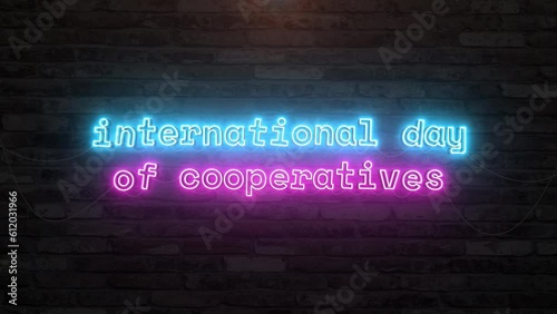 International day of cooperatives with neon text effect in wall background. Seamless looping video 