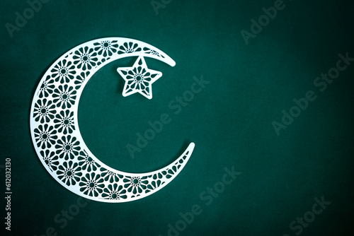 Sticker Crescent moon with star isolated on green background Eid al adha background, Ram