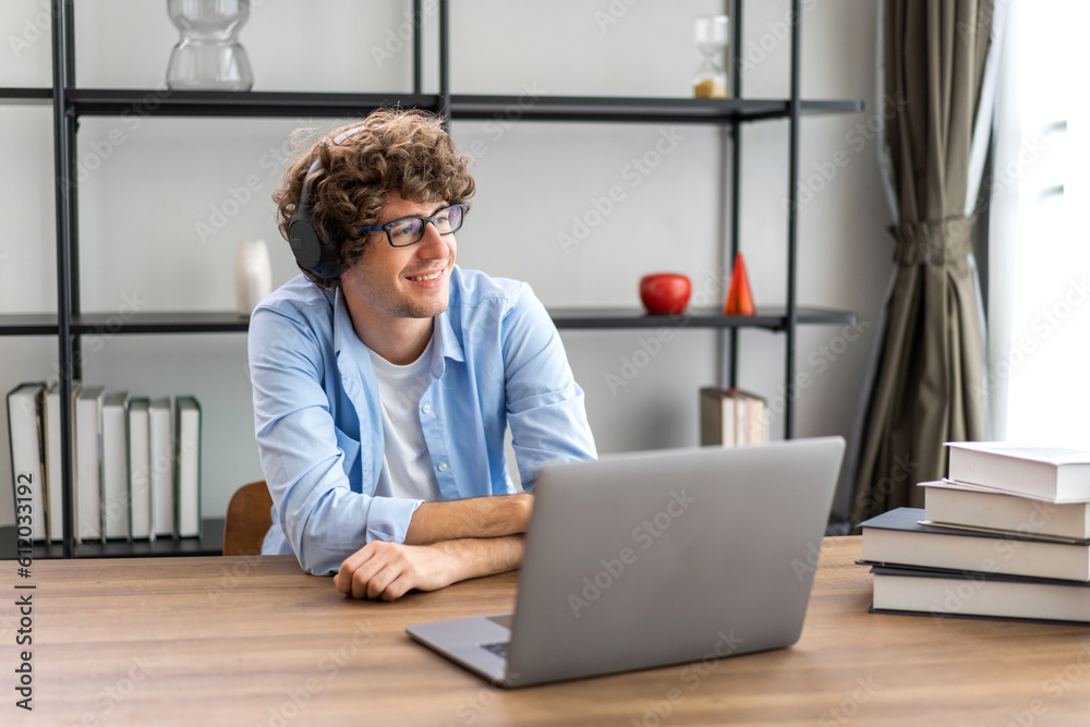 Young businessman work relaxing using technology laptop computer.Young creative man working and typing on keyboard, technology, online, email, job, project on bed at home