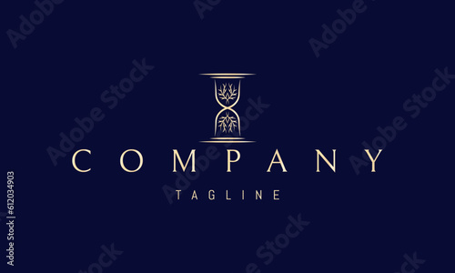 Vector golden logo on which an abstract image of an hourglass with a tree inside.