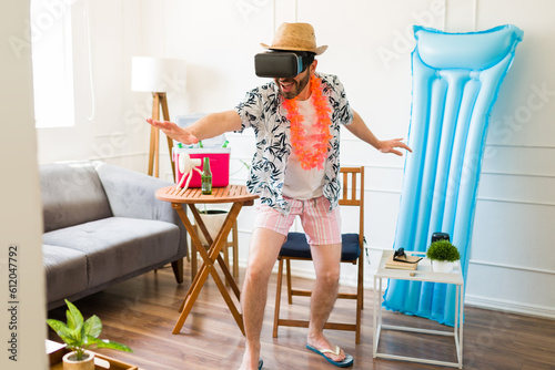 Photography Full length of a funny man using virtual reality pretending to have beach vacati