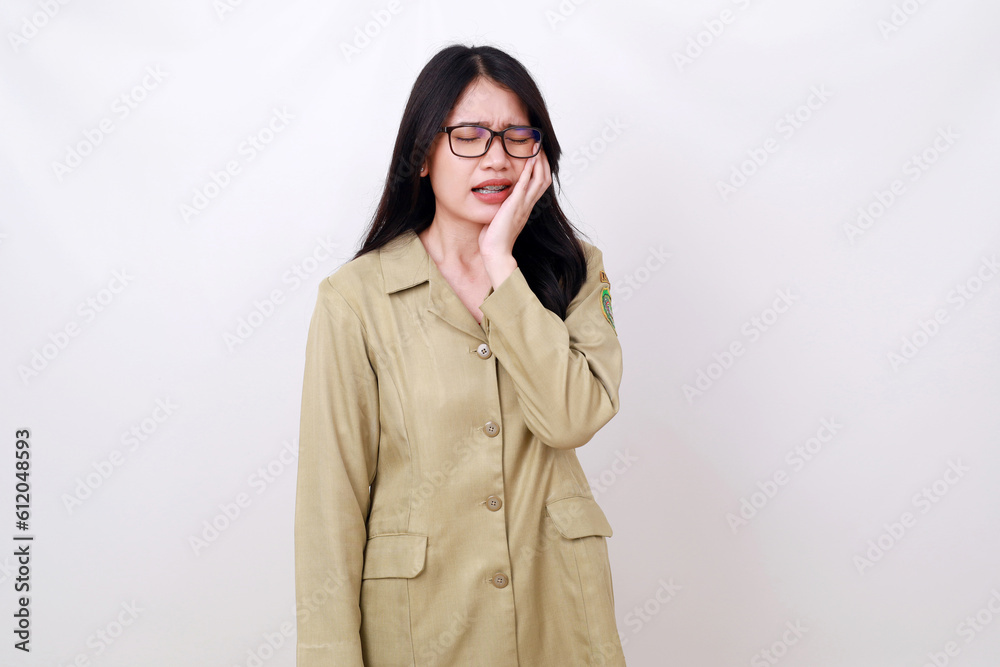 Young pretty Asian woman in civil servant costume having toothache. Isolated on white Young pretty Asian woman in civil servant costume having toothache. Isolated on white