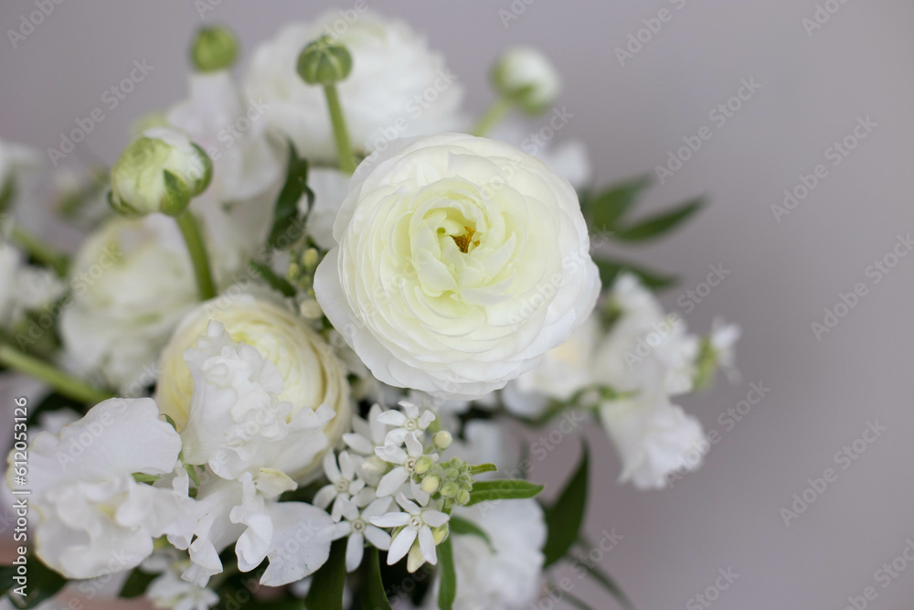 Bouquet of white flowers in female hands Bouquet of white flowers in female hands