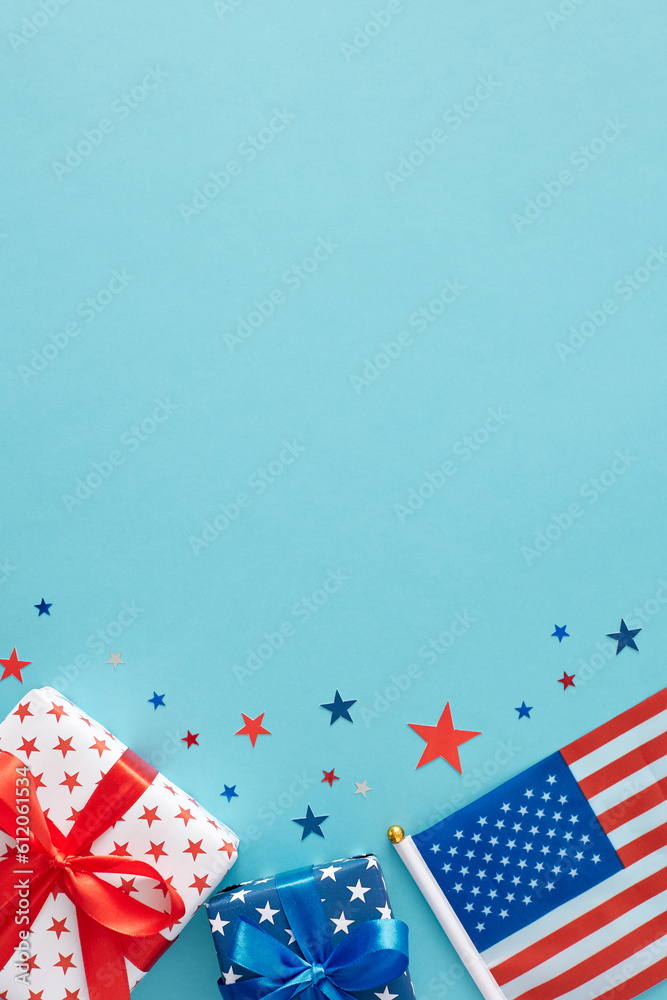 Obraz premium America's Independence Day festivities concept. Top view flat lay of national flag, gift boxes, stars on light blue background with space for text or ads