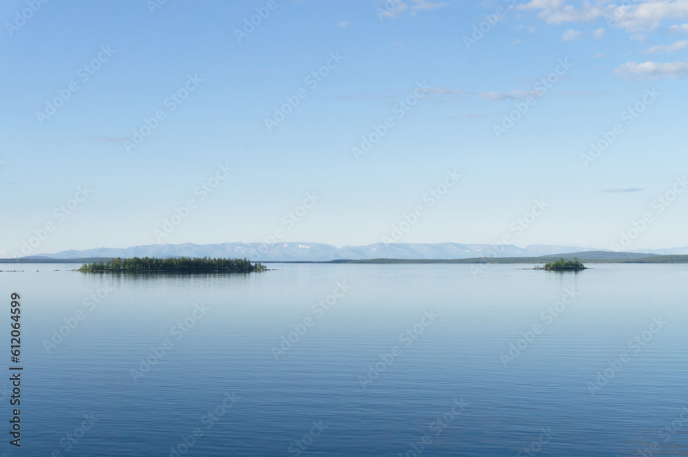 blue lake in the mountains in summer in sunny weather. Kola Peninsula, Murmansk region blue lake in the mountains in summer in sunny weather. Kola Peninsula, Murmansk region