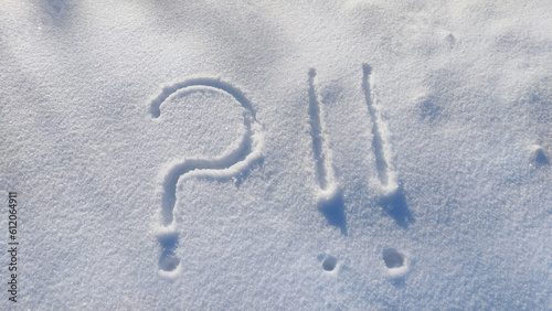 Canvastavla Question mark and exclamation mark on snowy surface close-up